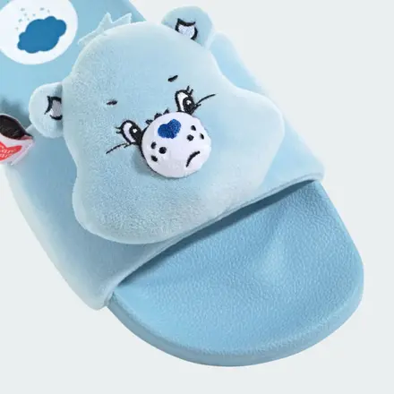 Light blue plush animal slipper with embroidered face and a soft, rounded sole