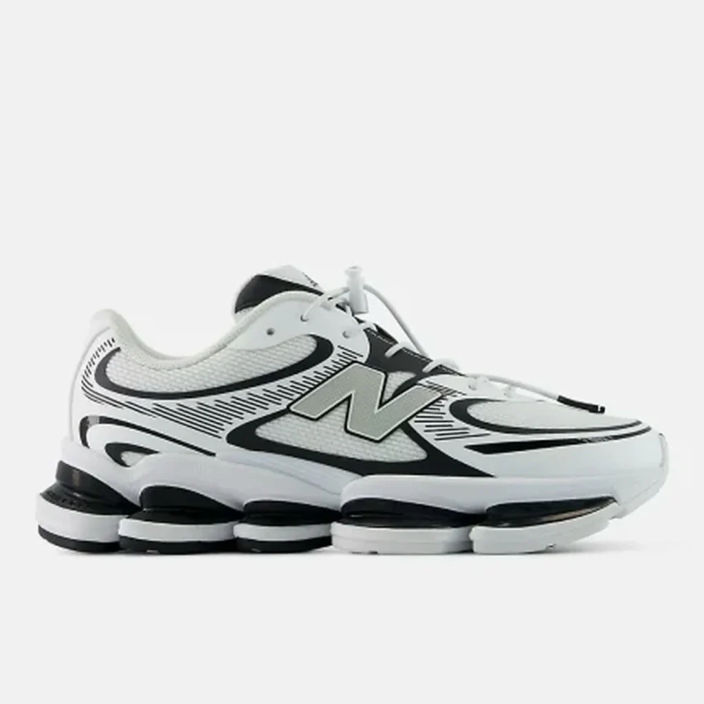 White New Balance run shoe with black accents, layered chunky sole and oversized N logo on a white background