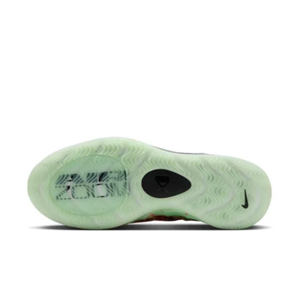 Pale green Nike basketball shoe outsole with wavy traction, black oval insert, and Nike swoosh on white background