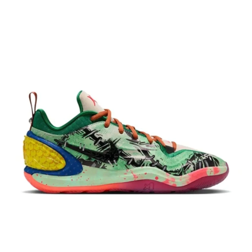 Nike A’Two basketball shoe in mint green with orange laces, black graphic overlays, blue heel, and yellow textured insert