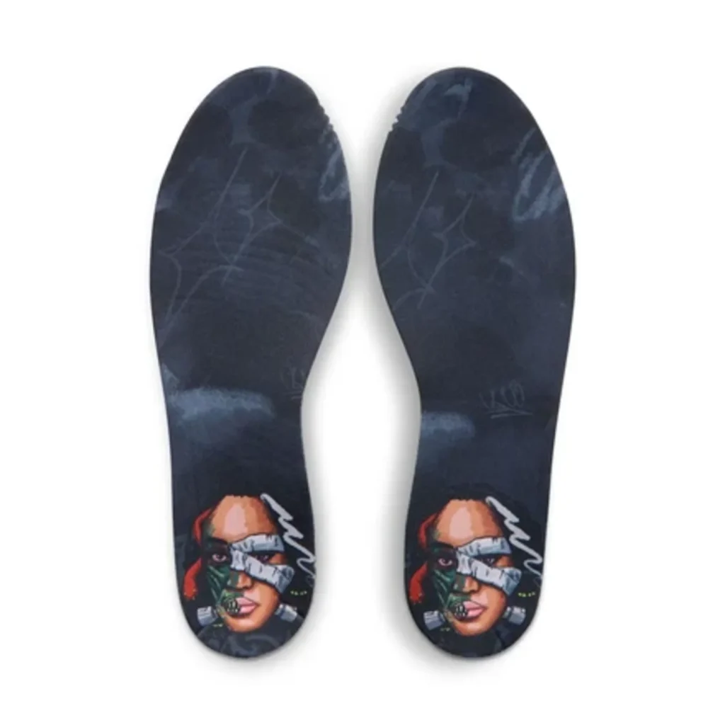 Pair of black basketball shoes with colorful illustrated faces and gray stitched graphics on the uppers, shown on white