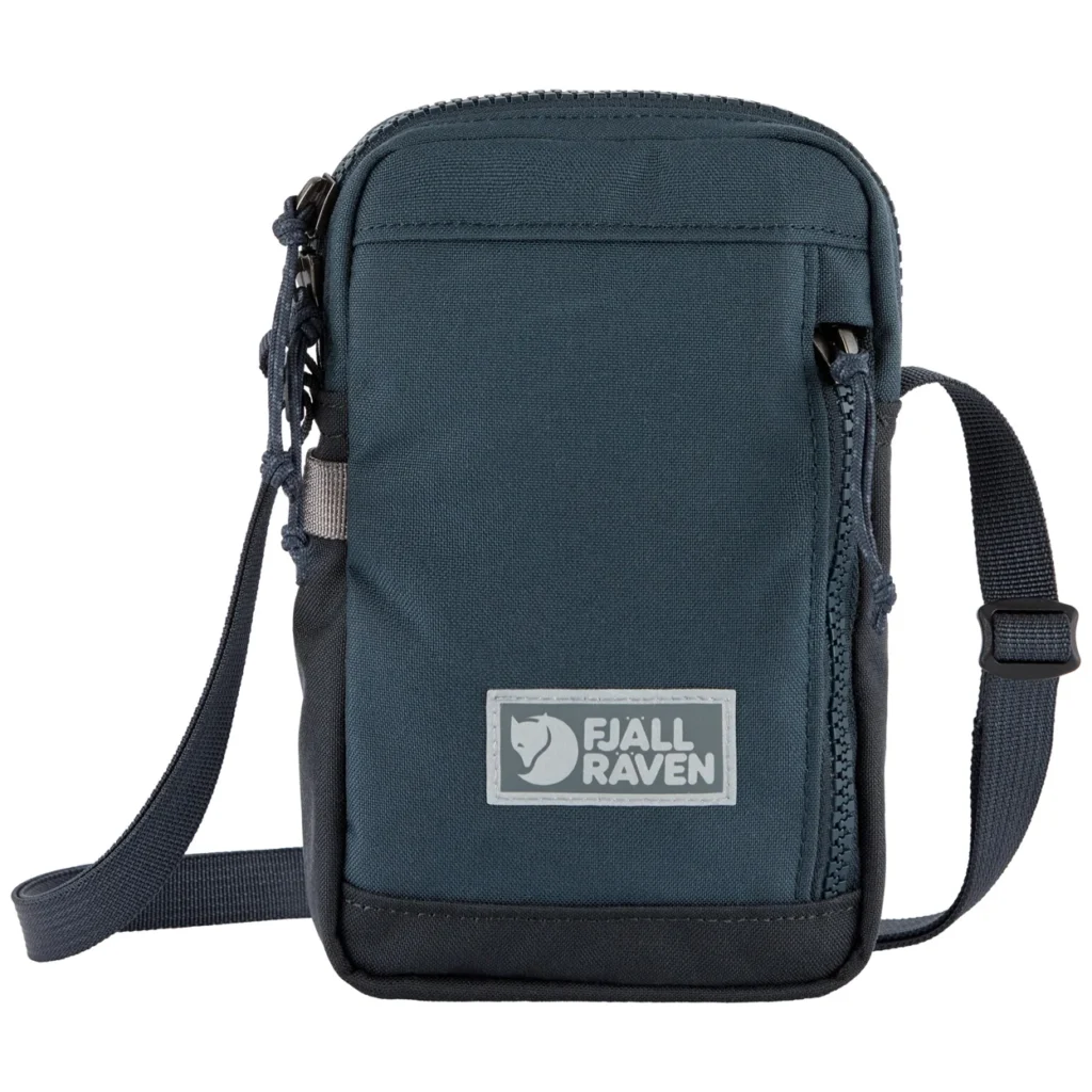 Dark blue Fjällräven crossbody bag with front pocket, adjustable strap, and logo patch